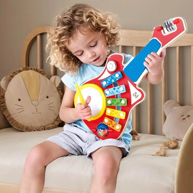 Guitare orchestre 6-en-1 - Jouets musicaux by Hape